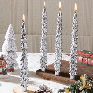 Silver Christmas tree shaped taper candles for festive holiday home decor and cozy ambiance.
