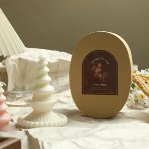 Scented candle gift set with unique tiered design and elegant round kraft paper box.