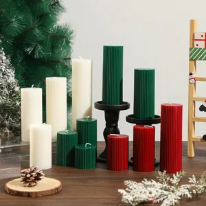 Detailed close-up of striped pillar scented soy wax candles for Christmas home decor and gifts.
