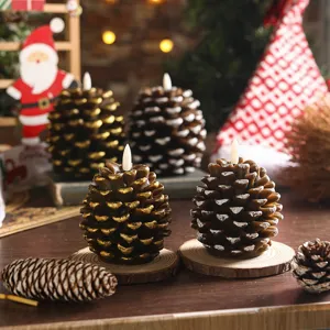 Close-up detail of Christmas pinecone LED candle lights with warm festive background.