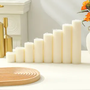 Detailed view of white Nordic striped pillar scented candles, home decor and wedding arrangement.
