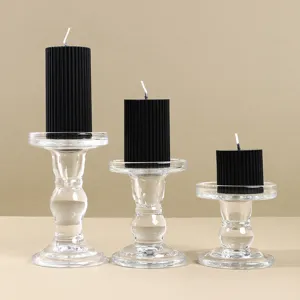 Conjunto de portavelas de vidrio vintage europeo con velas de pilar negras para decoracion