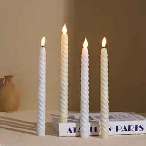 Close up of white twisted LED taper candles with realistic flickering flame for cozy decor.