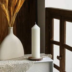 Nordic minimalist white striped pillar candle with pointed top, aesthetic scented candle for home decor.