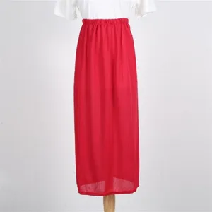 Detail view of the elegant red long skirt featuring an elastic high waist and lightweight fabric.