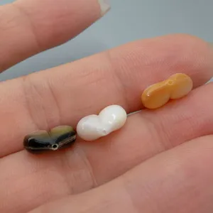 Natur Perlmutt Pfirsich Perle Detail in schwarz weiß gelb für DIY Schmuckherstellung.