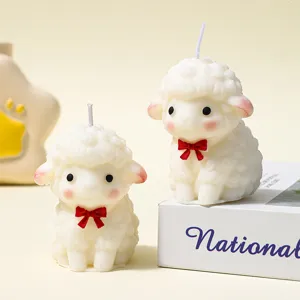 Cute little sheep scented soy wax candle with red bow for home decor and cozy atmosphere.
