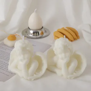 Detailed close-up of handmade white angel scented candles, perfect aesthetic home decor and photography.