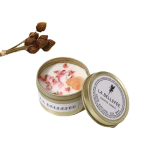 Gold tin scented soy wax candle with dried flowers and crystal for home decor gift.