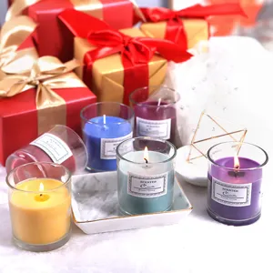 Scented soy wax candles in glass jars with gift boxes, ideal home aromatherapy and decor.