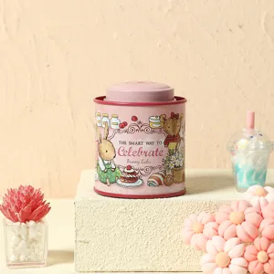Pink metal scented candle jar with cute bunny illustration, perfect for gift and home decor.