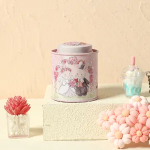 Charming pink metal scented candle jar featuring cute wedding rabbit illustration, ideal gift.