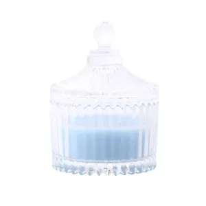 Clear glass jar scented candle with lid, blue soy wax candle for home decor and relaxation.