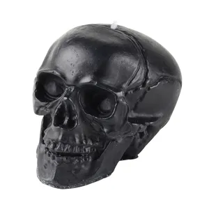 Schwarze totenkopf-förmige Kerze für Halloween Party Dekoration und gruselige Wohnkultur.