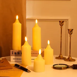Detailed close-up view of warm LED pillar candles with realistic flame effect for home decor.