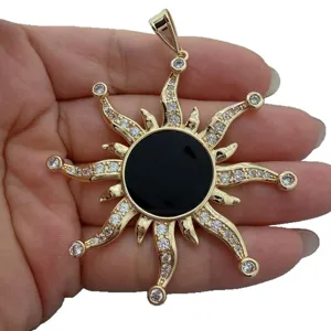 Retro gold sun pendant with black agate and zircon pave, elegant jewelry accessory.