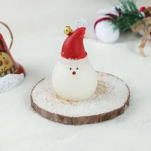 Christmas snowman scented candle with cute red santa hat and bell for holiday home decor details
