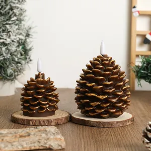 Christmas painted pine cone paraffin LED candle light, perfect holiday atmospheric decor props.