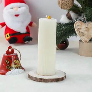 White pillar scented candle with wood slice base for Christmas party decoration and gift.