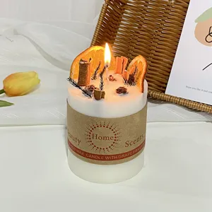 Handmade scented soy candle with dried fruit and cinnamon decoration for home decor and relaxing.