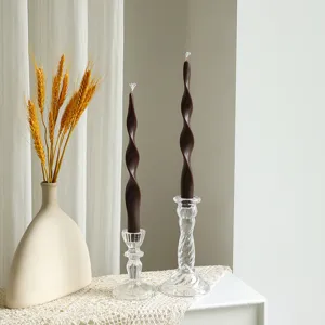 Detail view of 25cm twisted long pillar soy wax scented candle in glass holder for home decor.