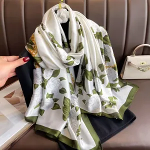 Elegant white silk scarf with green floral and chain print, luxury style shawl for women.