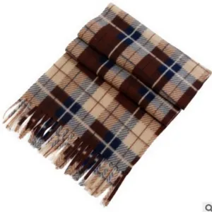 Detail view of winter plaid scarf with classic checkered pattern and fringe trim design.