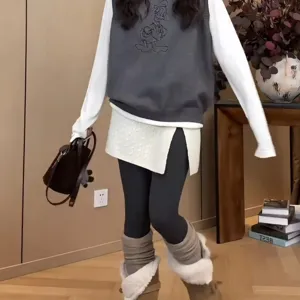 Women layered knit vest sweater and wrap skirt outfit casual winter fashion apparel stylish.