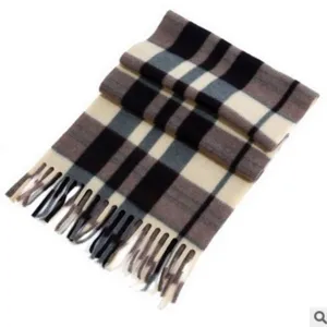 Classic plaid winter scarf with fringe detail, cozy double-sided fabric for cold days.