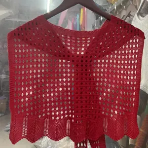 Red hollow-out knitted shawl detail, summer beach sun protection wrap scarf, lightweight outerwear.