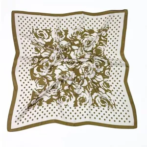 Detailed view of the elegant vintage olive green floral and polka dot square silk scarf.