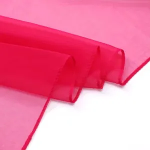 Detailed view of a vibrant magenta imitation silk long scarf, lightweight solid shawl.