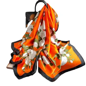 Elegant orange silk scarf with white camellia flowers and black border for women fashion.