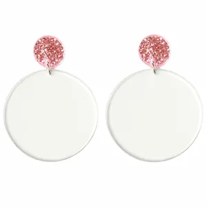 Acrylic first grade earrings with glitter top and colorful printed text for back to school.