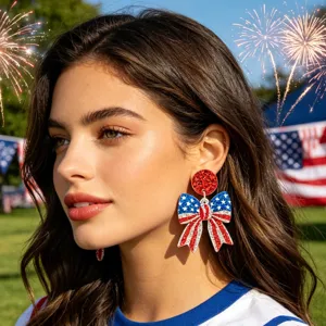 US Independence Day patriotic bow earrings detail shot, red white and blue glitter design.