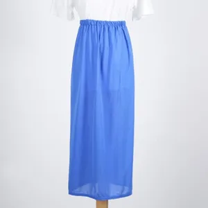 Blue solid color long skirt detail showing elastic waist and breathable fabric texture.