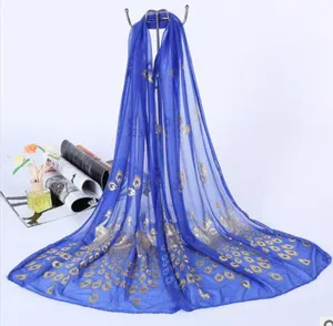 Royal blue sheer gauze scarf featuring elegant gold foil peacock feather prints for beach or daily wear.