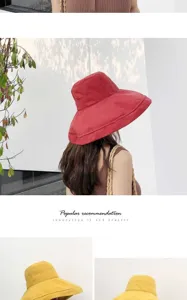Detail view of the peach skin velvet bucket hat, showing the wide brim and solid color fabric.