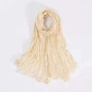 Lightweight crinkled plain scarf for women, elegant beige shawl and long neck wrap.