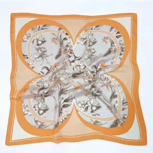 Detailed view of the retro floral square silk scarf, featuring an elegant orange border.