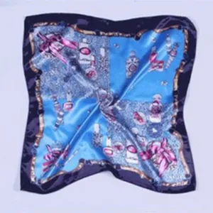 Elegant blue printed silk square scarf with luxury chain and perfume bottle motifs for women.