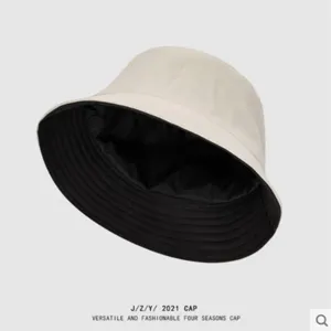 Reversible solid color bucket hat detail view, casual sun protection fashion chic hat.