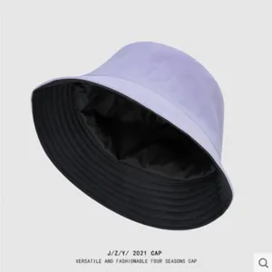 Details of the solid color double-sided sun protection bucket hat, simple style.