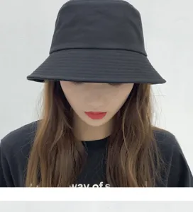 Classic black cotton bucket hat for women and men, sun protection casual fisherman hat.
