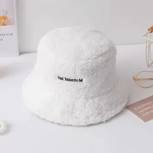 White lamb wool bucket hat for women, cozy plush winter basin hat with chic embroidered letters.