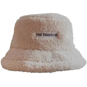 White sherpa fleece bucket hat detail, cozy plush winter cap with custom front embroidery.