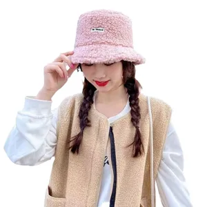 Cozy pink sherpa bucket hat for women, soft plush winter warm fisherman cap stylish.