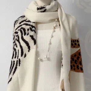 Detailed view of the stylish women animal print scarf, featuring a chic zebra and leopard mix.