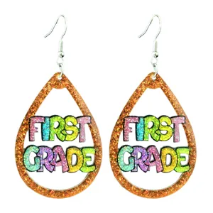 Glitter teardrop hollow earrings detail, colorful first grade design, teacher jewelry accent.