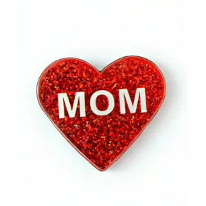 Red glitter heart brooch detail shot, shiny mother gift badge with MOM text display clearly.